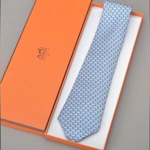 HERMES New Unused  Neck Tie Light Blue with White Geometric Design